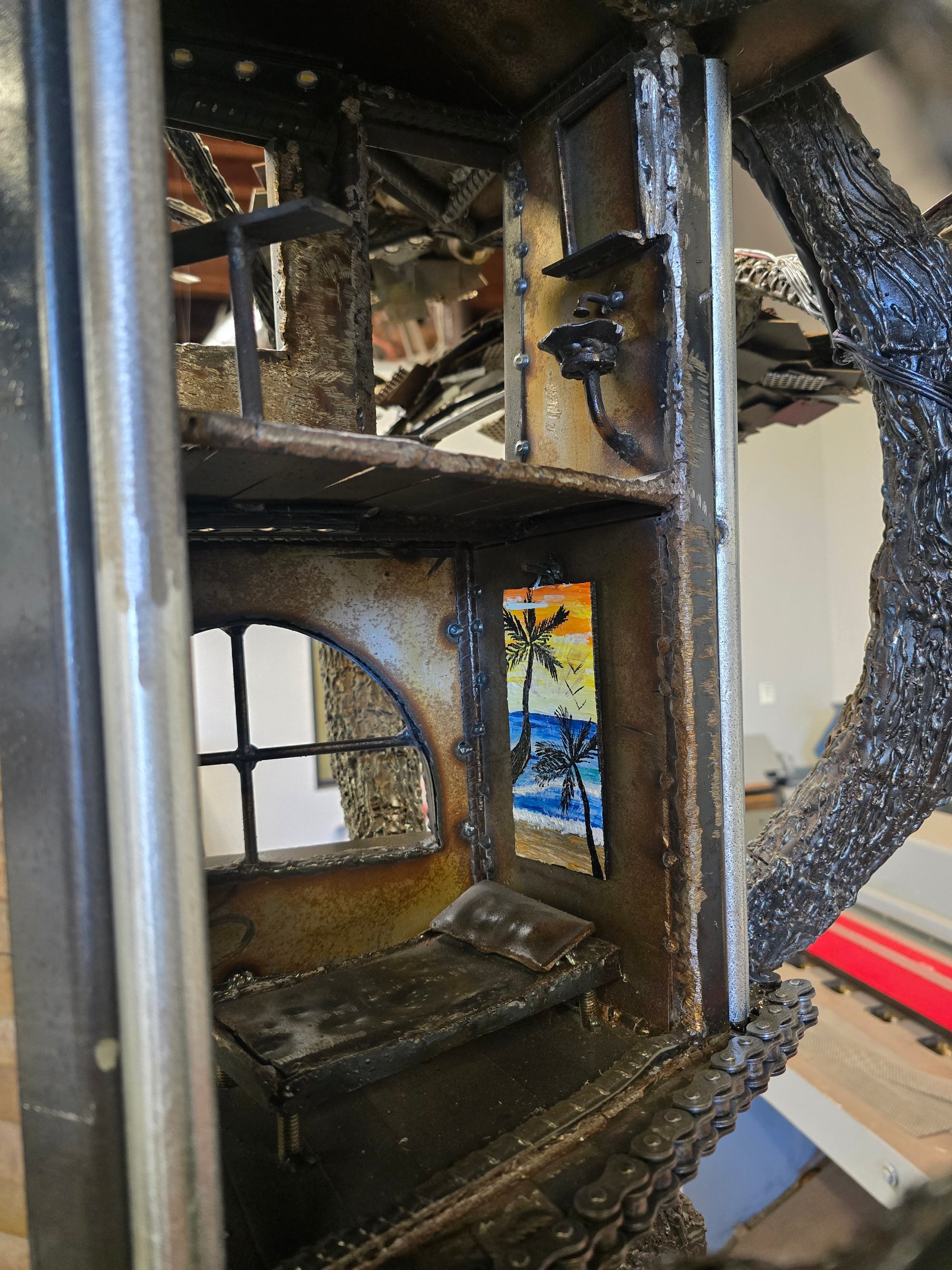Close view through the house in Heaven on Earth showing interior architectural details, windows, railings, and layered steel construction.